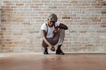 Man throwing dices on floor