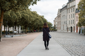 A business woman is walking on the street at Switzerland.