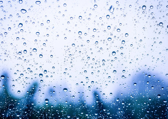 Naklejka na ściany i meble Drops of the rain on the home window.