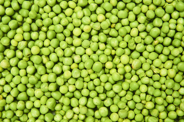 Fresh green peas background texture top view
