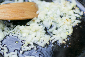 Fried onions in a frying pan.