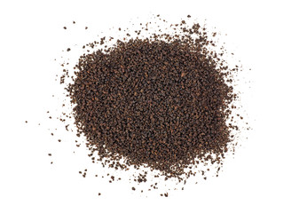 Black tea granules on a white background. Top view.