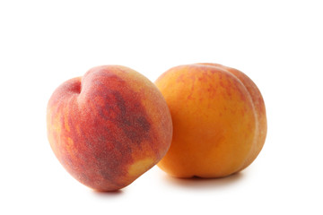 Ripe peaches fruit isolated on a white background