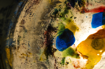 Obraz na płótnie Canvas multi-colored paint on uneven surface