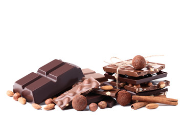 Chocolate pieces with nuts and cinnamon isolated on white background
