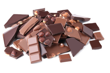 Chocolate pieces with hazelnuts isolated on white background
