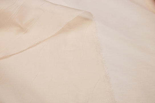 Silk fabric, organza is light beige.
