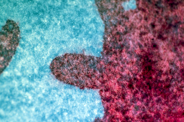 multi-colored paint on uneven surface