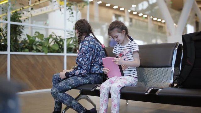 Two sisters at the airport they asked to come for tablet