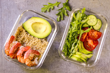 Healthy meal prep containers with quinoa and shrimp