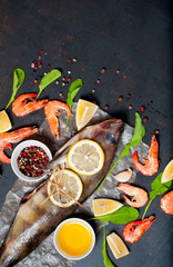 Seafood, fish and shrimp on a dark background. menu for the cafe.