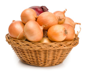 Onions in a basket isolated on white background