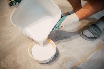 Open can of white paint