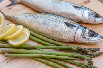 raw mackerel on wooden board