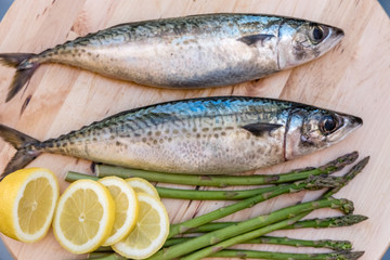 raw mackerel on wooden board