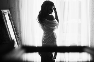 Wonderful bride in white dress near the castle 