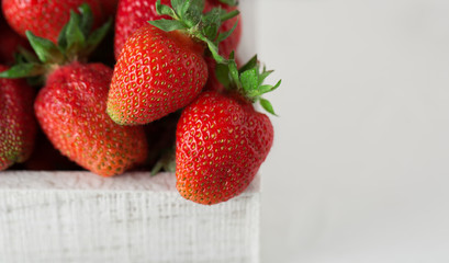 Fresh juicy strawberries with leaves. Strawberry background. Healthy food concept. Fresh organic berries
