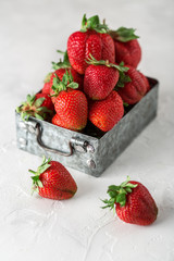Fresh juicy strawberries with leaves. Strawberry background. Healthy food concept. Fresh organic berries