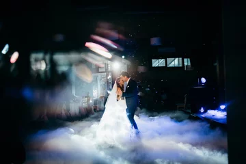 Foto op Canvas Wedding dance of happy couple in the restaurant  © shunevich