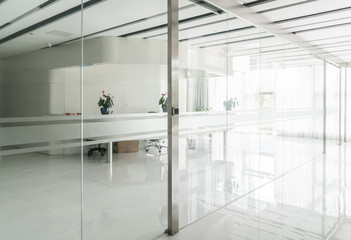 A modern office building with glass doors and windows