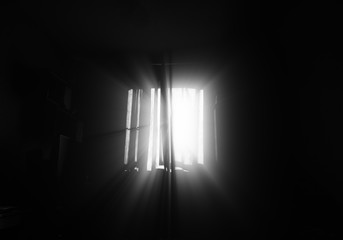 Dramatic light rays from room window background