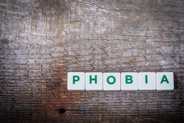 Word Phobia, letters on the rustic background