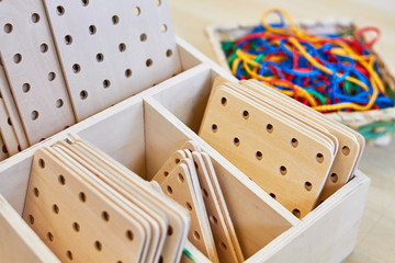 Set of colorful strings and wooden shapes