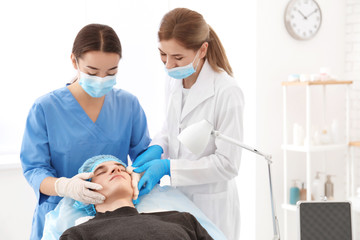 Professional beautician teaching trainee in salon. Apprenticeship concept