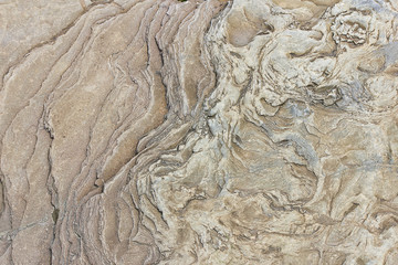 stone surface with the natural pattern and stains close up