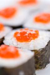 Sushi set and composition at white background. Japanese food restaurant, sushi maki gunkan roll plate or platter set.