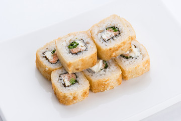 Sushi set and composition at white background. Japanese food restaurant, sushi maki gunkan roll plate or platter set.