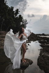 Fototapeta na wymiar Sensual bride wearing beautiful wedding dress