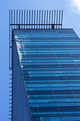 blue background of office building windows and cctv