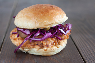 fried crispy chicken sandwich with red cabbage slaw