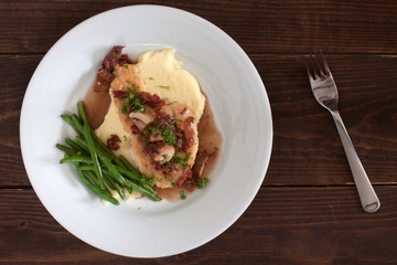 Delicious chicken marsala served with potatoe mash and green beans