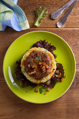 Homemade burger or patty with mashed potato on lettuce. View from above, top studio shot