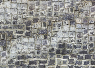 Fototapeta na wymiar Antique natural stonewall, old stones in different sizes