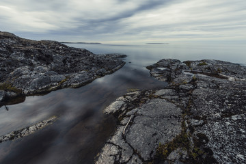 Ladoga lake at summer night. White night at Ladoga lake in Karelia, Russia. Long exposure landscape photo