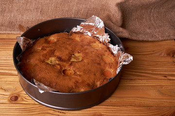 apricot pie baked in foil with ingredients cinnamon, abricot, eggs, flour, milk and sugar