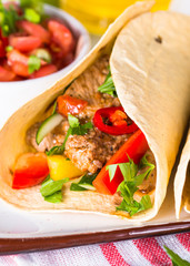 Mexican pork tacos with vegetables and salsa.