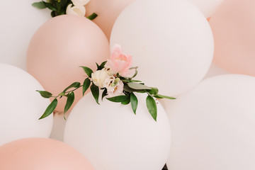 It is a lot of white and pink balloons. White-pink background