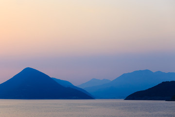 Fototapeta na wymiar Mountains silhouette behind the ocean, Montenegro