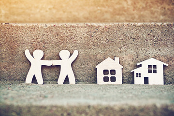 little wooden men and house on natural background. Symbol of construction, neighborhood, sweet home concept - 209778811