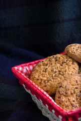 Cookies with sesame and sunflower seeds on plaid. Healthy eating