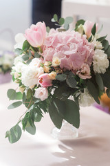 Composition from flowers - decoration of a table for guests.