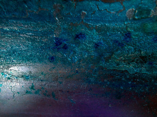 multi-colored paint on uneven surface