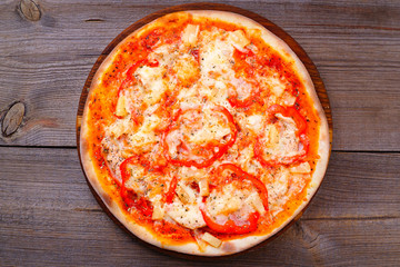 Delicious pizza Hawaiian with pineapple and ham.  traditional recipe, mediterranean cuisine, junk fattening street food, italian restaurant, pizzeria menu concept