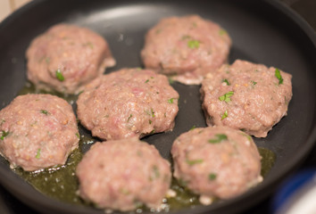 Chicken cutlets in frying pan. fresh meat and oil