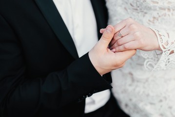 Marriage day The young cute couple walks and spends time at the local beach near the lake