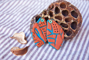 Unique boho turquoise earrings with handmade pattern. Jewelry from polymer clay.